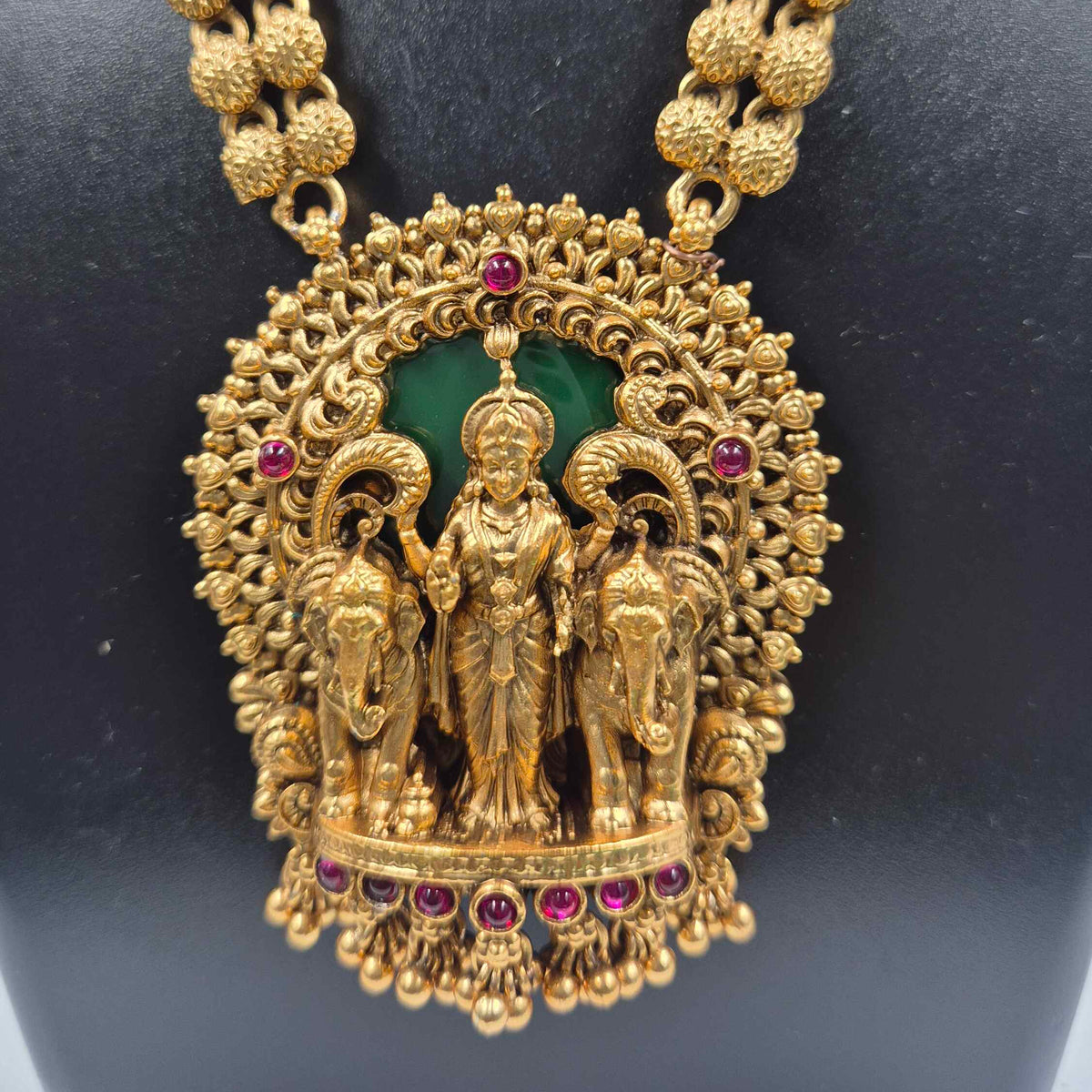Gajalakshmi haram Set with Green Stones and Jhumkas