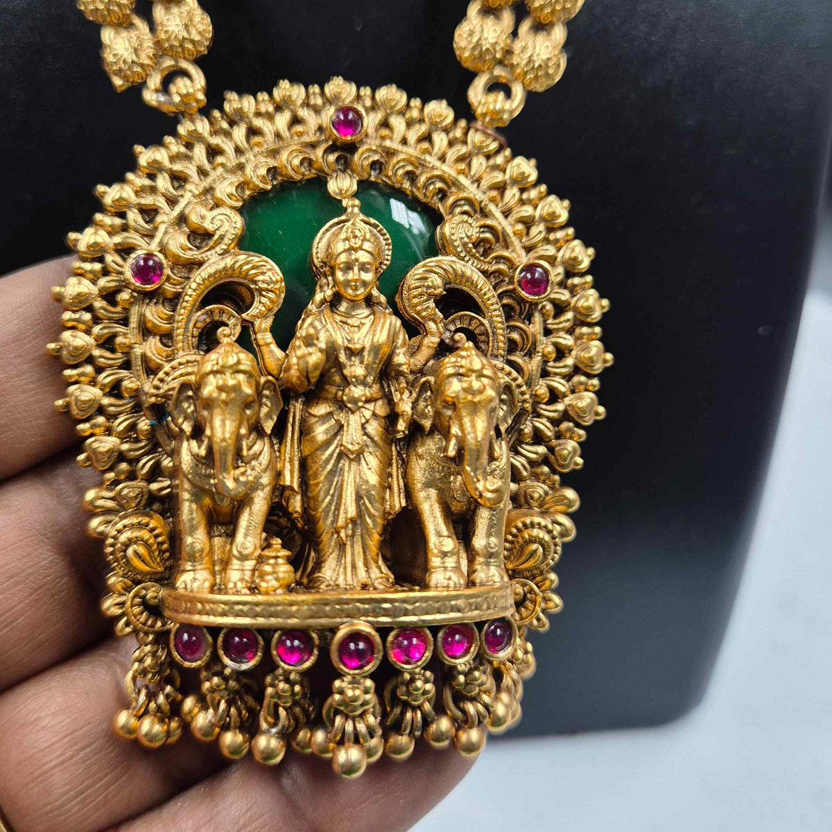Gajalakshmi haram Set with Green Stones and Jhumkas