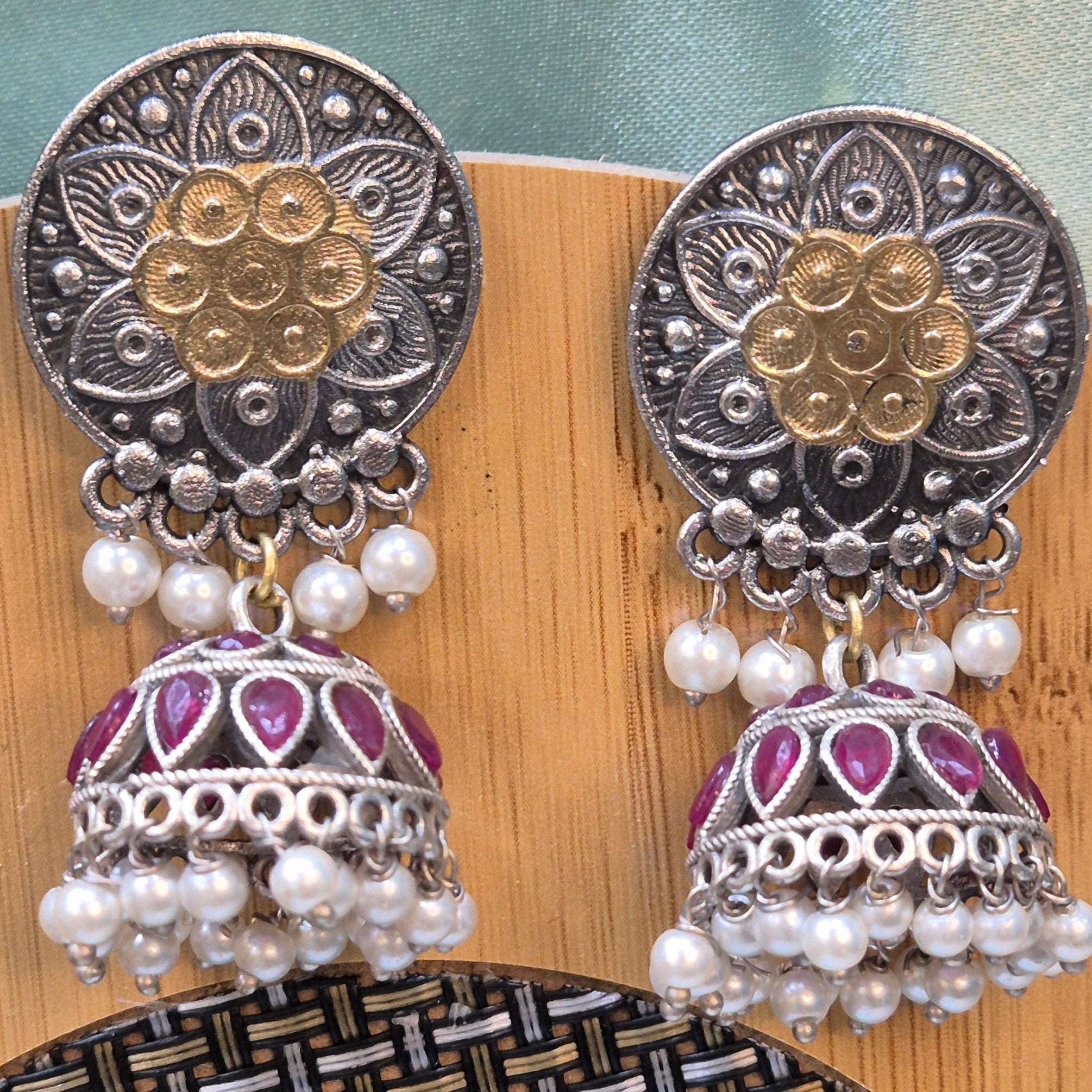 Big Jhumka In Dual Tone With Red Stones